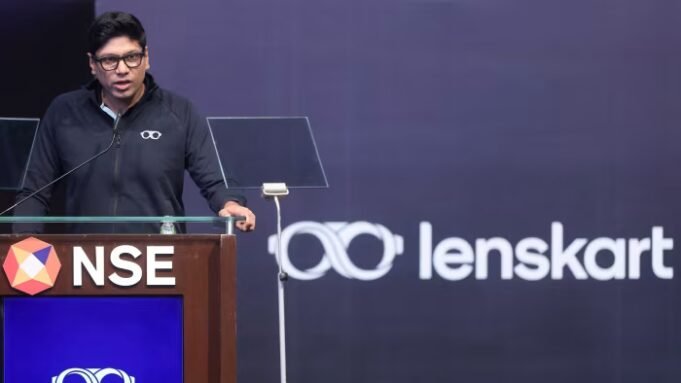 Peyush Bansal speaks at a podium during Lenskart’s IPO listing ceremony, with the Lenskart logo and NSE branding visible behind him.